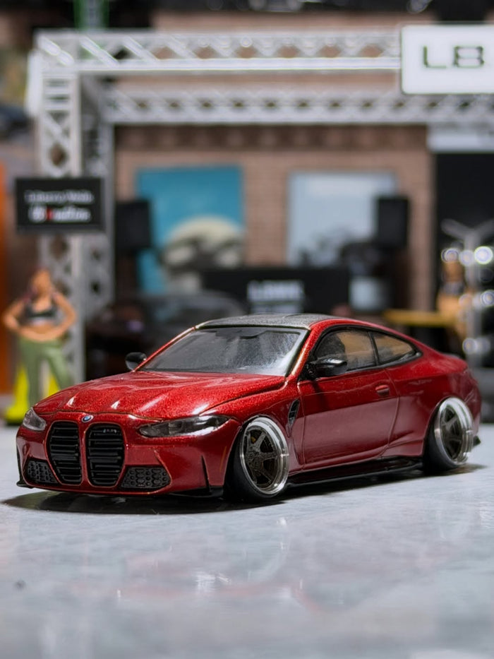 Red BMW M4 on wide wheels