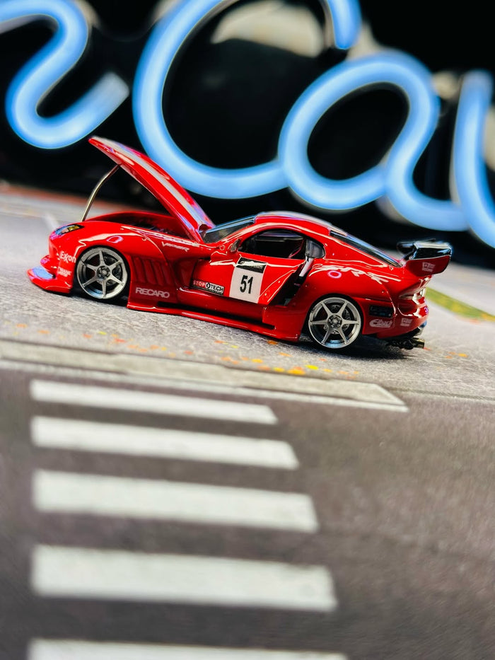 Red racer with open hood